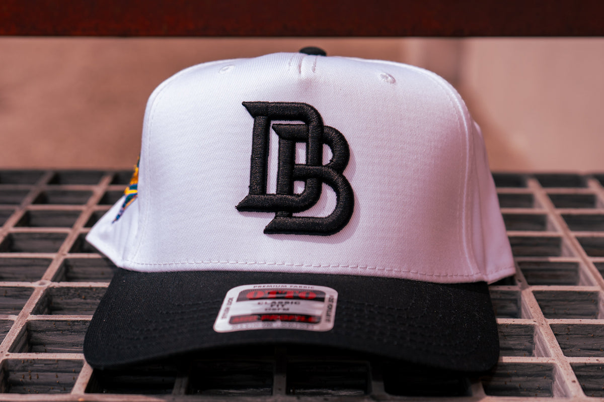 Choose one Chalio’s collab hat: White / Black — included in the Player & Mom Bundle.