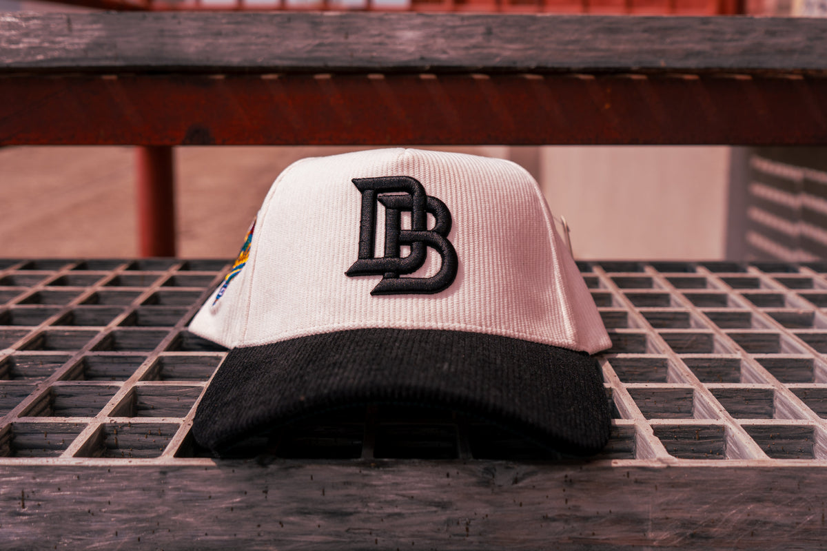 Choose one Chalio’s collab hat: White / Black Corduroy — included in the Player & Mom Bundle.