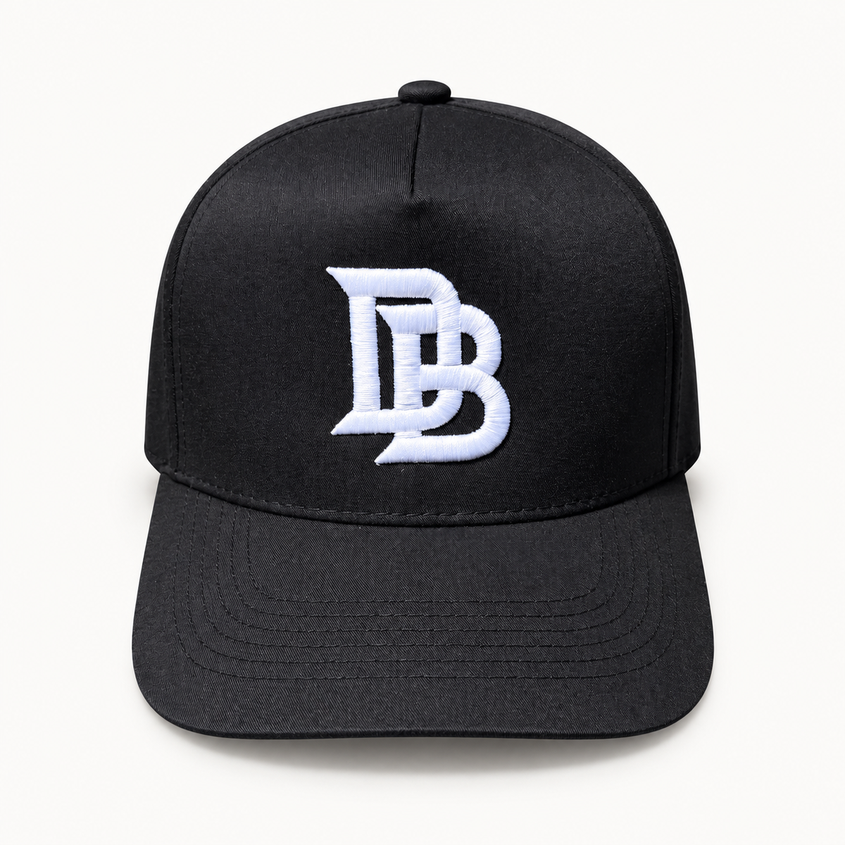 Black DB Snapback, digitally retouched product photograph on a neutral background.